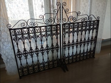 Séparateur de pièce en fer forgé.